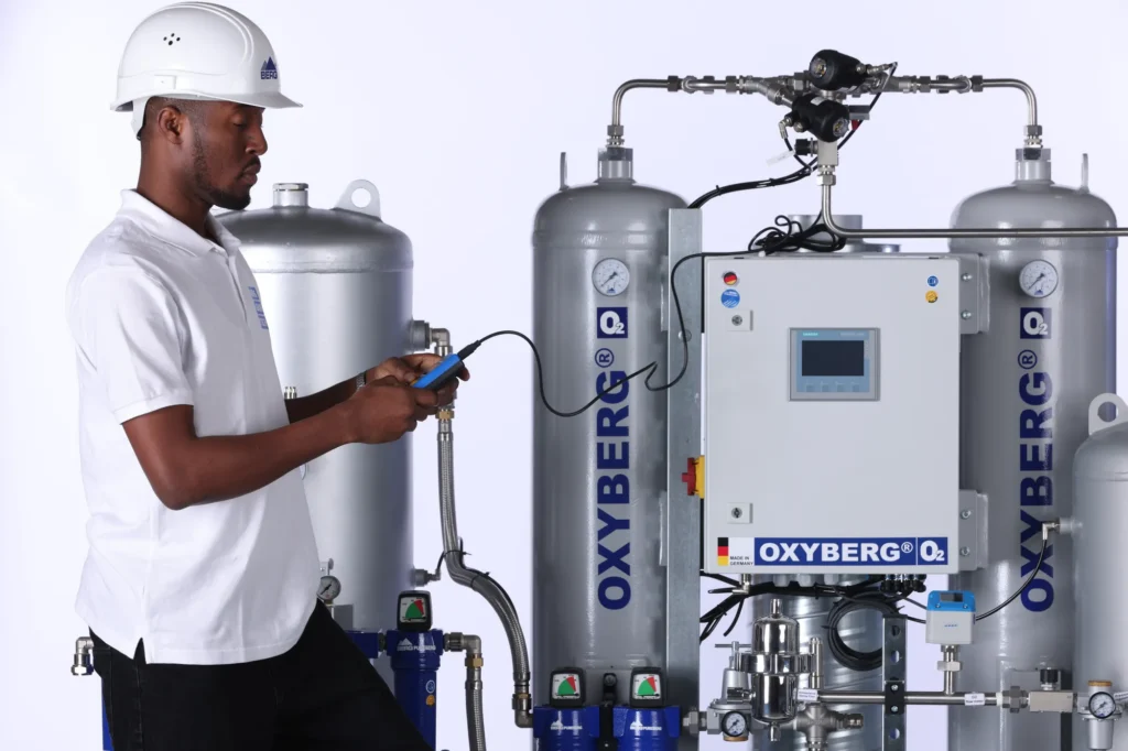 Berg GaseTech technician measuring oxygen purity at an OXYBERG® twin-tower PSA oxygen generator